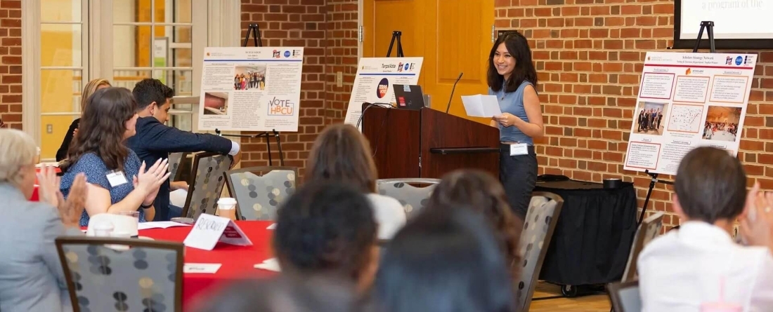 student speaks in front of a crowd